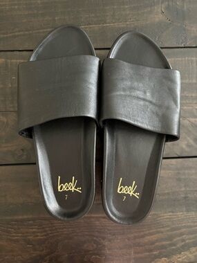 beek Black Leather Slide Sandals with Gold Logo
